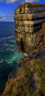 Majestic cliffside with ocean view and lush landscape.