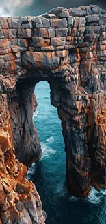 Majestic coastal rock arch above ocean waters.