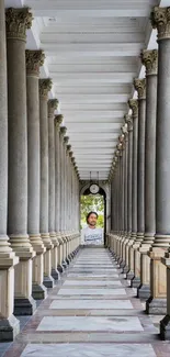 Majestic corridor with tall columns leading to an archway.