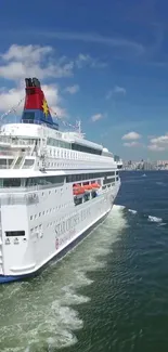 Cruise ship sailing on a clear blue ocean.