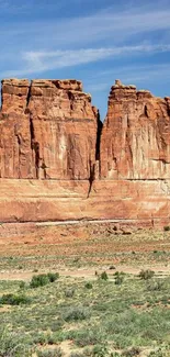 Desert rock formation under clear sky.