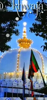 Illuminated dome at night with a vibrant blue sky backdrop.