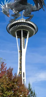 Dragon perched atop iconic tower under a clear blue sky.