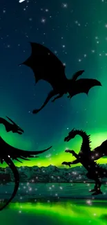 Silhouetted dragons against vibrant aurora night sky.