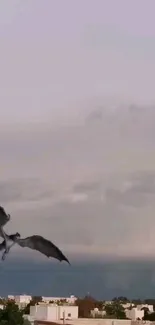 Dragon soaring in cloudy sky over cityscape.