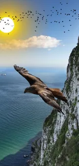 Eagle soaring over ocean cliff with sunset.