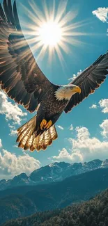A majestic eagle soars in a clear blue sky over mountainous terrain.