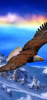 Eagle flying over snowy mountains under blue sky.