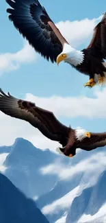 Two bald eagles soar over mountains in a bright blue sky wallpaper.