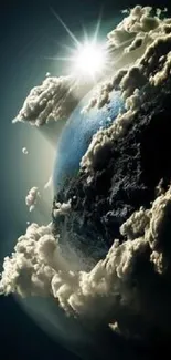 Planet Earth with clouds and sunlight in a dramatic space view.