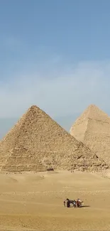 Majestic view of Giza Pyramids in Egypt under clear blue sky.