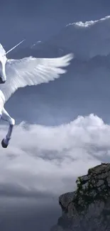 Winged unicorn soaring over misty mountains in a fantasy scene.