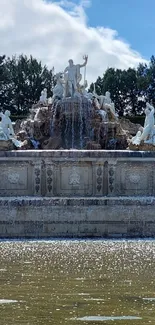 Majestic fountain sculpture with tranquil waterscape.