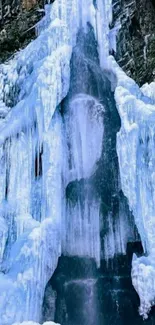 Majestic frozen waterfall on rugged cliff.