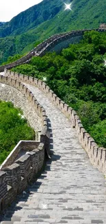 Great Wall of China surrounded by lush green mountains.