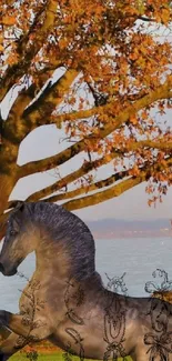 Majestic horse under autumn tree by lake.