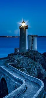 Lighthouse casting light over a serene ocean at dusk.