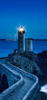 Lighthouse at dusk with ocean blues.