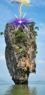 Lone rock formation with lightning against blue sky and water.