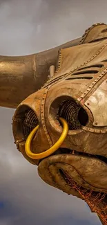 Sculpted mechanical bull with bronze tones.