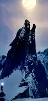 Moonlit mountain with snowy peak and glowing night sky.