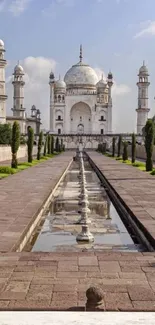 Majestic mosque with blue sky and green landscape background.