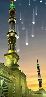 Majestic mosque tower under golden sunset sky.