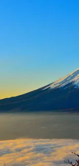 Tranquil mountain scene with sunrise over snowy peak and vibrant sky.