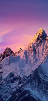 Majestic snow-capped mountain at sunset with purple and pink skies.