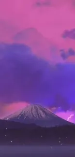 Majestic mountain under a vibrant twilight sky with pink and purple clouds.