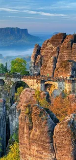 Majestic stone bridge over rocky cliffs with scenic mountain views.