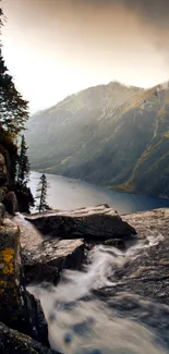 A breathtaking mountain view with a river flowing through rocky cliffs.