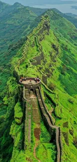 Majestic green mountain fortress vista, perfect for mobile wallpaper.