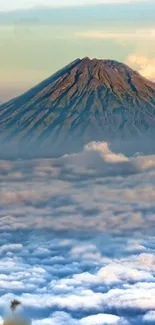 Mountain peak rising above the clouds in a serene mobile wallpaper.