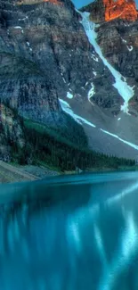 Scenic mountain lake with sunset reflection.