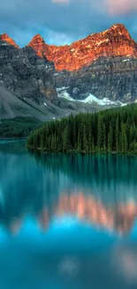 Peaceful mountain lake reflecting sunrise hues in serene natural landscape.