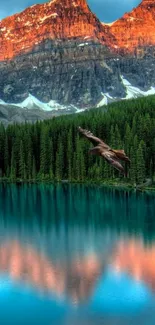 Eagle soaring over teal lake reflecting sunset mountain.