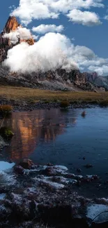 Majestic mountain with lake reflecting at dusk.