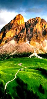 Stunning mountain landscape with green fields and rocky cliffs under a vibrant sky.