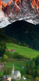 Majestic mountain landscape with green valley and rocky peaks.