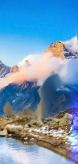 A majestic mountain landscape with clouds and a vibrant blue sky.