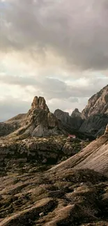 Majestic rocky mountain landscape under a cloudy sky.