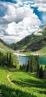 Scenic mountain view with green hills and a blue lake under a cloudy sky.