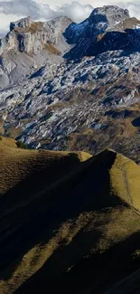 Majestic mountain landscape with rocky peaks and lush valleys.