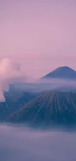 A serene mountain mist scene with pink and purple sky over volcanic peaks.