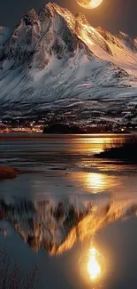 Snow-covered mountain with moonlit reflection in a tranquil lake at night.