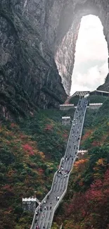 Mountain pathway with vibrant scenery and stunning natural arch.