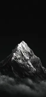 Monochrome mountain peak in misty setting