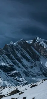 Snowy mountain peaks under a deep blue sky wallpaper.