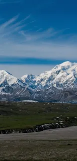 Majestic snow-capped mountains under a clear blue sky.